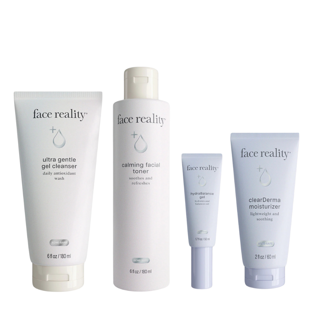 A set of four skincare products from Face Reality, including an ultra gentle gel cleanser, calming facial toner, hydrating gel, and clearDerm moisturizer, presented in white and blue packaging.