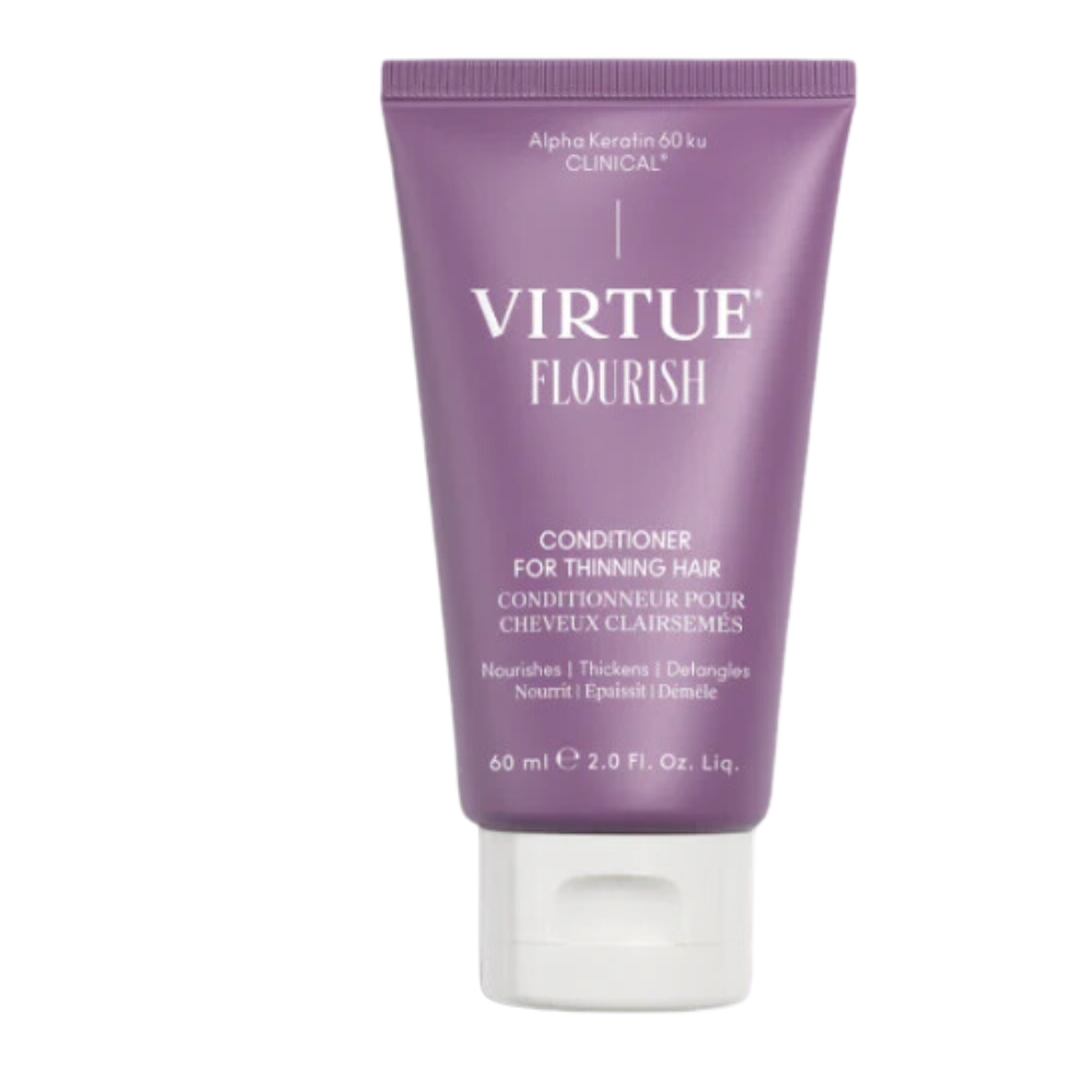 A travel size tube of Virtue Lab Conditioner with a purple label, indicating it is a conditioner for thinning hair.