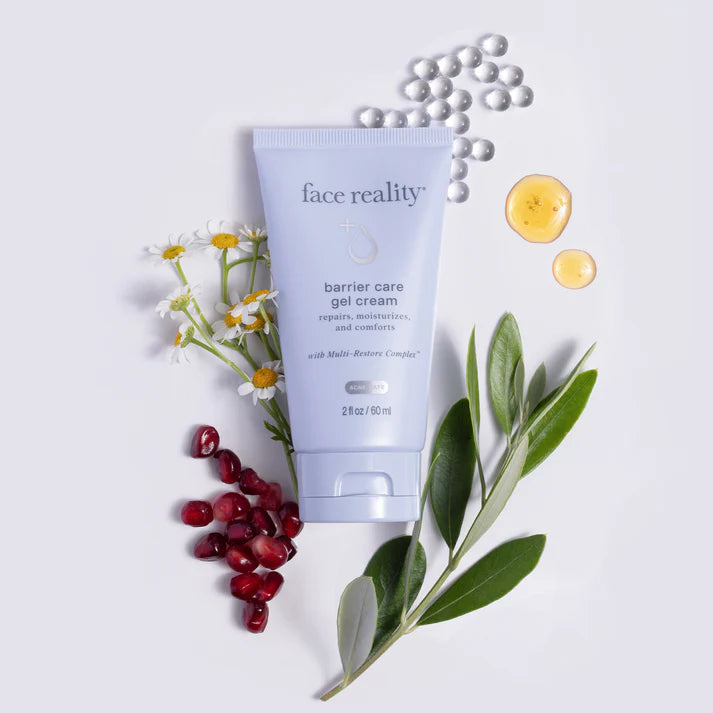 Tube of 'face reality' barrier care gel cream with pomegranate seeds, leaves, and flowers on a light background